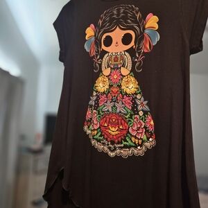 black shirt with mexican doll